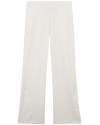 Gcds - Monogram-Pattern Trousers - Lyst