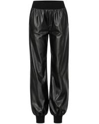 Norma Kamali - Ribbed-Knit Trim Faux-Leather Track Pants - Lyst