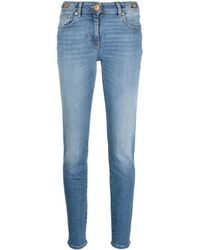 Versace - Skinny-Jeans Mit Medusa-Kopf - Lyst