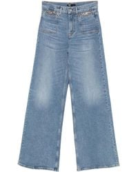 Maje - Vaqueros acampanados con detalle de cadena - Lyst