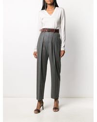 Brunello Cucinelli - Pantalones tapered a rayas - Lyst