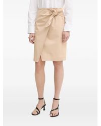 Isabelle Blanche - Knot-Detail Wrap Mini Skirt - Lyst