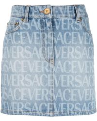 Versace - All-over Logo Denim Mini Skirt - Lyst