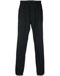 Versace - Logo-patch Trousers - Lyst