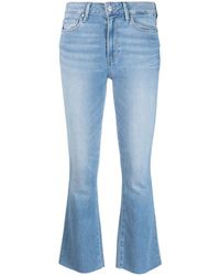 PAIGE - Ausgestellte Jeans mit Logo-Patch - Lyst