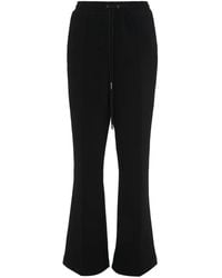 JW Anderson - Slim-Cut Flared Track Pants - Lyst