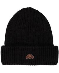 PELO FOUNDATION - Gorro con aplique de perro - Lyst
