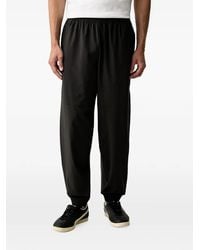 PUMA - Logo-Print Elasticated-Waist Track Pants - Lyst