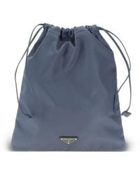 Prada - Logo-Plaque Drawstring Shoulder Bag - Lyst