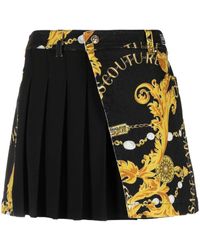Versace - Logo Couture Pleated Denim Skirt - Lyst