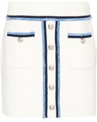 Maje - Decorative-buttons bouclé miniskirt - Lyst