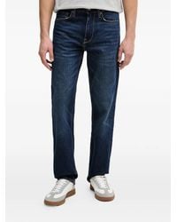 Guess - Logo-Patch Jeans - Lyst