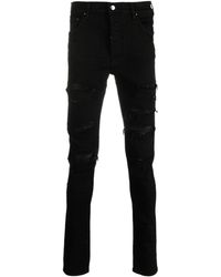 Amiri - Skinny-Jeans mit Logo-Patch - Lyst