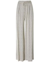 Pinko - Flared Polka-Dot Satin Trousers - Lyst
