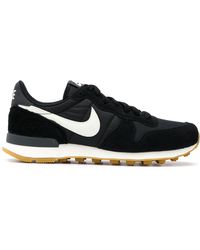 nike black and gold internationalist trainers