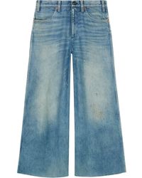 Gucci Hose aus Denim mit Patchs - Blau