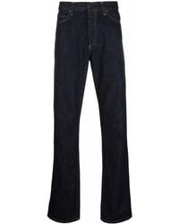 Carhartt - Logo-Patch Denim Jeans - Lyst
