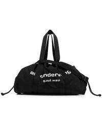 Womens Bags Duffel bags and weekend bags Alexander Wang Synthetic primal Drawstring Logo Nylon Duffle Bag in Black 