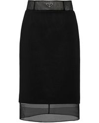 Prada - Falda a capas con logo triangular - Lyst