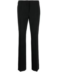 pantalons en chinos voor Lange broeken Dames Kleding voor voor Broeken Moschino Katoen Trainingsbroek Met Logoprint in het Zwart 