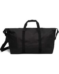 Rains - Embossed-Logo Duffle Bag - Lyst
