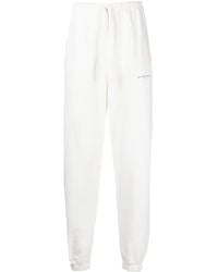 ih nom uh nit - Pantalones de chándal con logo estampado - Lyst