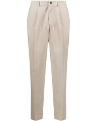 Dell'Oglio - Pleated Cotton-blend Tapered Trousers - Lyst