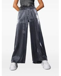Liu Jo - Laminated Flared Trousers - Lyst