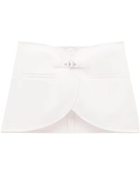 Courreges - Ellipse Buckled Curved Miniskirt - Lyst