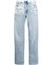 DIESEL - Jeans con strappi a vita media - Lyst