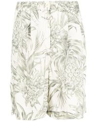 Tommy Hilfiger - Pantalones cortos con motivo floral - Lyst