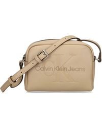 Calvin Klein - Embossed-Logo Cross Body Bag - Lyst