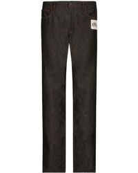 Dolce & Gabbana - Jeans a gamba ampia con applicazione - Lyst