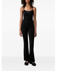 Sporty & Rich - Joan Bold Logo-Print Flared Jumpsuit - Lyst
