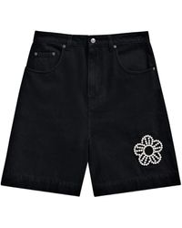 Area - Jeans-Shorts mit Kristallblume - Lyst