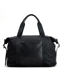 Tod's - Logo-Debossed Leather Duffle Bag - Lyst