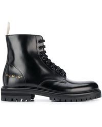 woman by common projects combat boots