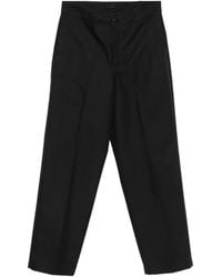 Prada - Logo-Plaque Trousers - Lyst
