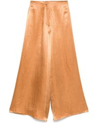 Nanushka - Pantalones de satén - Lyst