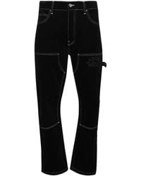 Amiri - Logo-embroidered Carpenter Trousers - Lyst