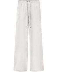 Versace - Drawstring-Fastening Knitted Flared Trousers - Lyst