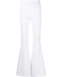 Genny - Zipped Flared Trousers - Lyst
