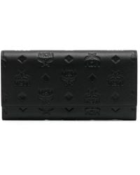 MCM - Large Aren Embossed-monogram Leather Wallet - Lyst