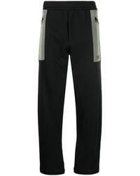 McQueen - Pantalones de chándal con bolsillo en contraste - Lyst