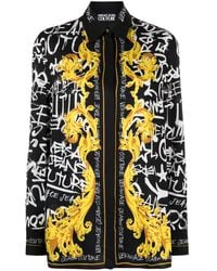 Versace - Blusa con stampa Logo Couture - Lyst