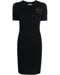 Versace - Kleid mit Logo-Print - Lyst