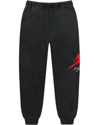 Nike - Pantalones de chándal con logo - Lyst