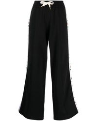 CASABLANCA - Pantalones de chándal con franjas del logo - Lyst