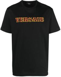 Versace - T-shirt con applicazione logo - Lyst