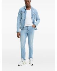 HUGO - Vaqueros con parche del logo - Lyst